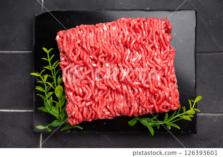 Raw beef and pork mince meat, mincemeat, on black background. 126393601