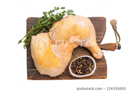 Raw chicken leg on cutting board, farm poultry meat isolated on white background 126393693