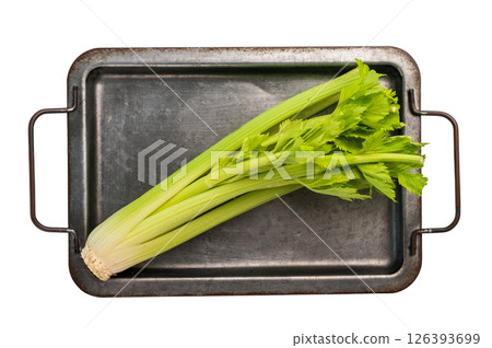 Raw uncooked celery sticks on kitchen tray isolated on white background, top view Raw uncooked celery sticks on kitchen tray isolated on white background, top view 126393699