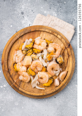 Frozen Raw Seafood Cocktail with Mussels, Clams, Prawns, Shrimps and squid. grey background. top view 126393798