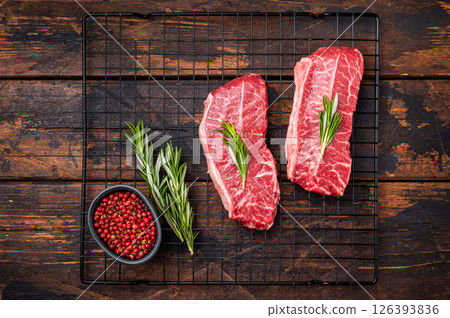 Raw Top blade steak, marbled black angus prime beef. wooden background. top view Raw Top blade steak, marbled black angus prime beef. wooden background. top view 126393836