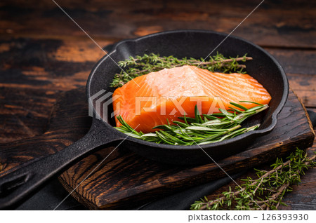 Ready for cooking Fresh Salmon fillets, raw fish steaks in a pan. wooden background. top view 126393930