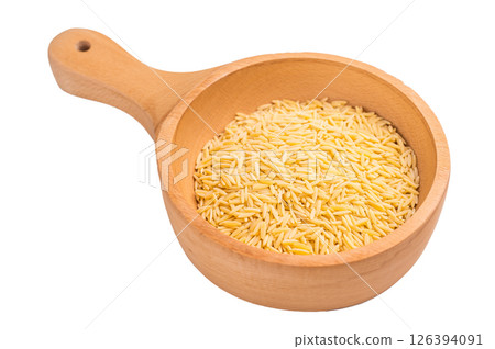Raw Orzo pasta, uncooked dry Italian risoni in a bowl isolated on white background. top view 126394091