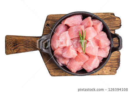 Raw turkey fillet pieces, diced poultry breast meat in a skillet isolated on white background. top view 126394108