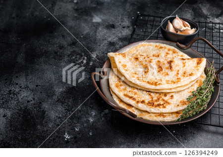 Aloo Paratha Indian Potato stuffed Flatbread. black background. top view 126394249