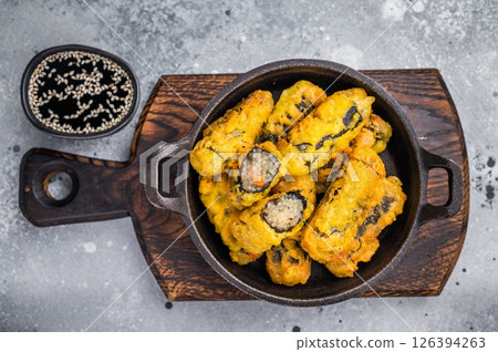 Korean Crispy seaweed noodle rolls Gimmari deep-fried seaweed rice rolls. grey background. top view Korean Crispy seaweed noodle rolls Gimmari deep-fried seaweed rice rolls. grey background. top view 126394263