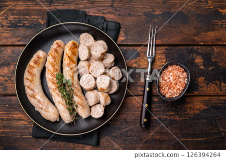Grilled Sausages with forcemeat mincemeat and herbs in plate. wooden background. top view Grilled Sausages with forcemeat mincemeat and herbs in plate. wooden background. top view 126394264