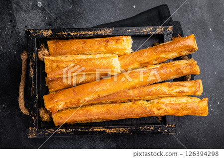 Bread sticks with cheese and salt. black background. top view 126394298