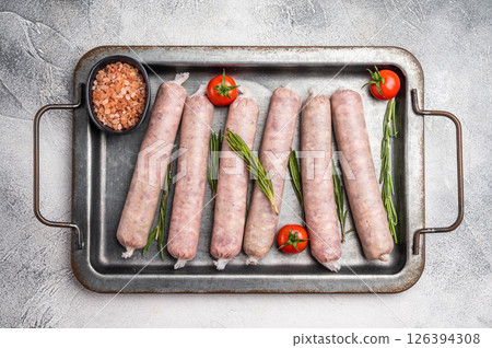 Fresh Sausages with minced pork and veal meat, wurst with herbs. grey background. top view 126394308