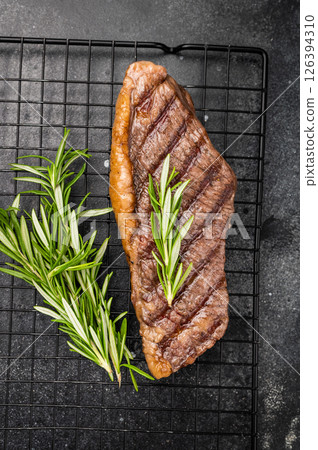 Grilled Brazilian picanha, rump cap beef steak. black background. top view 126394310