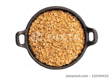 Raw buckwheat flakes in a skillet isolated on white background. top view 126394410