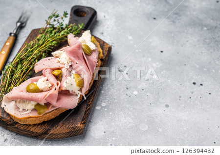 Open Sandwich with Prosciutto Cotto, mozzarella and olives. grey background. top view 126394432