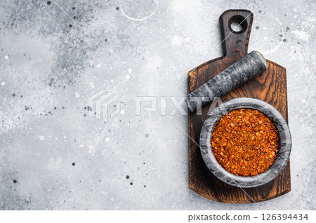 Cooking of Red Chili pepper and paprika flakes. grey background. top view 126394434