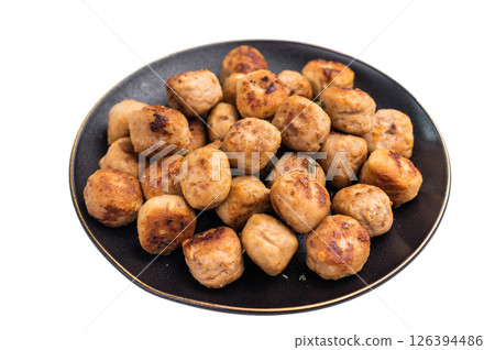 Savory meatballs, meat dumplings garnished with fresh herbs. A delightful addition to any meal, bringing warmth and satisfaction to the table. isolated on white background. top view 126394486