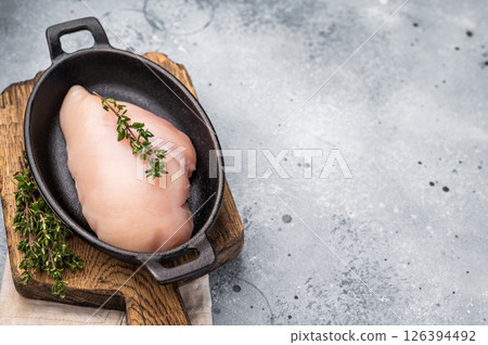 Raw white meat cuts, showcasing their natural shape and quality. A staple ingredient for countless delicious dishes in any kitchen. grey background. top view 126394492