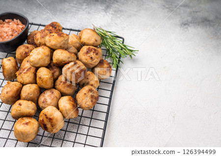 Fried Meatballs from beef and pork minced meat garnished with fresh herbs. grey background. top view Fried Meatballs from beef and pork minced meat garnished with fresh herbs. grey background. top view 126394499