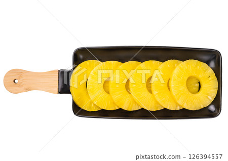 Canned Pineapple rings slices on a board isolated on white background. top view Canned Pineapple rings slices on a board isolated on white background. top view 126394557