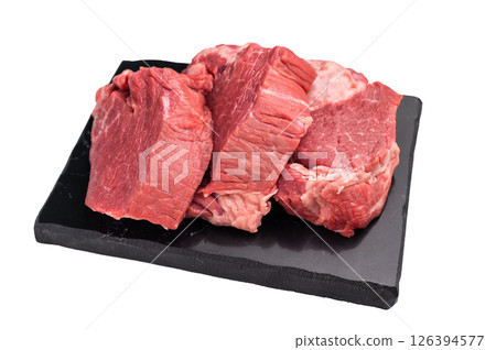 Raw beef boneless shank shin presented with herbs and spices, inspiring bold flavors and unique recipes for adventurous home cooks.. isolated on white background. top view 126394577
