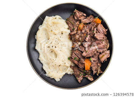 Beef stew with mashed potatoes, carrots and herbs on a plate isolated on a white background. top view Beef stew with mashed potatoes, carrots and herbs on a plate isolated on a white background. top view 126394578