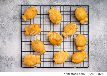 Korean pancake Bungeoppang, Fish shaped Waffle with sweet red bean filling. white background. top view Korean pancake Bungeoppang, Fish shaped Waffle with sweet red bean filling. white background. top view 126394695
