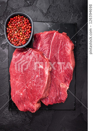 Raw Roe Deer steak, fresh Wild Venison Game Meat. black background. top view 126394698