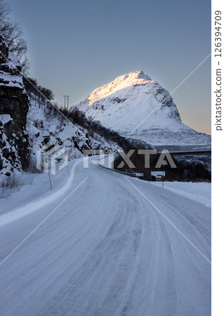 Winter road and a mountain, Norway Winter road and a mountain, Norway 126394709