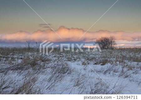 Winter meadow and sunrise clouds, Norway Winter meadow and sunrise clouds, Norway 126394711