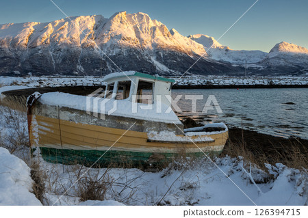 Boat and a mountain in sunrise, Norway 126394715