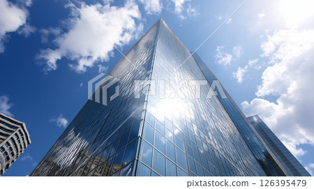 Glass-clad skyscrapers towering into the blue sky 126395479