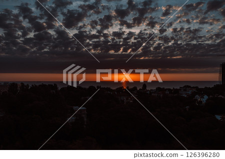 Evening sky with dramatic clouds over the sea. Dramatic sunset over the sea. Evening sky with dramatic clouds over the sea. Dramatic sunset over the sea. 126396280