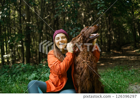 Excited Woman with Dog in Forest Excited Woman with Dog in Forest 126396297