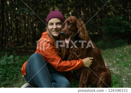 Outdoor Portrait of Woman with Pet Dog 126396331