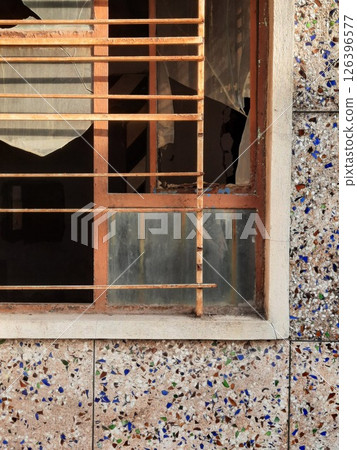 abandoned building with broken window - close up shot abandoned building with broken window - close up shot 126396577