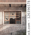 abandoned building with broken window 126396578
