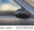Side rear-view mirror closed for safety - close up shot 126396584