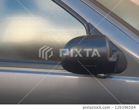 Side rear-view mirror closed for safety - close up shot 126396584