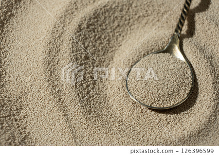 Dry Baking Yeast in a Spoon Close-Up 126396599