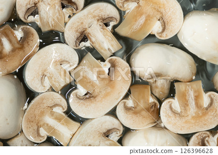 Raw White Button Mushrooms Champignons Close-Up Splash in a Water Top View 126396628