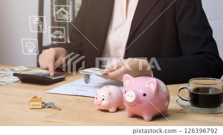 Allocate money for household expenses concept. people use calculator to calculate and divide money into bills for house utility payment. home budget investment strategy management. 126396792