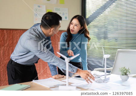 ESG Collaboration in Business Meeting. Professionals strategizing on sustainable solutions. ESG Collaboration in Business Meeting. Professionals strategizing on sustainable solutions. 126397085