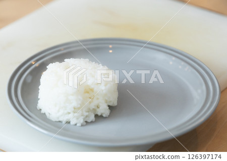 Rice served in a cup on a lunch plate (stock photo) 126397174