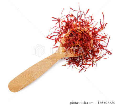 Saffron spice in a wooden spoon on a white background. Top view 126397280
