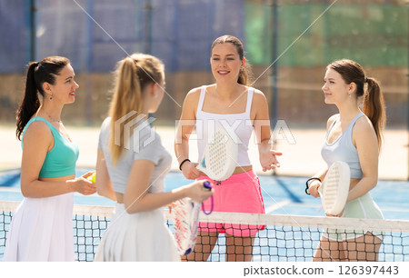 Women standing and talking on the court Women standing and talking on the court 126397443