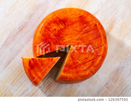 Image of goat cheese with pepper on wooden desk 126397593