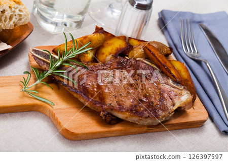 Appetizing entrecote with baked potatoes Appetizing entrecote with baked potatoes 126397597