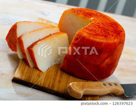 Tasty french goat cheese with pepper at wooden desk 126397623
