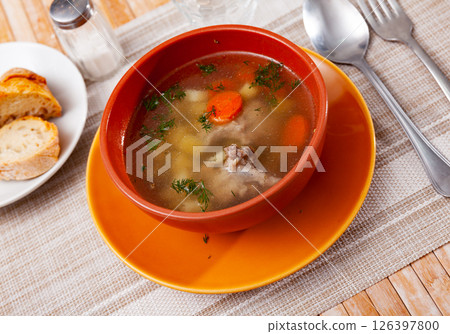 Bowl with meat soup served on table 126397800