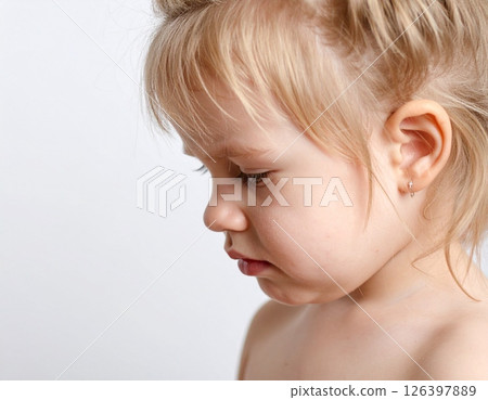 Portrait of a crying Caucasian girl (white background) Portrait of a crying Caucasian girl (white background) 126397889