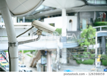 Close up of a CCTV security camera overlooking urban area 126398059