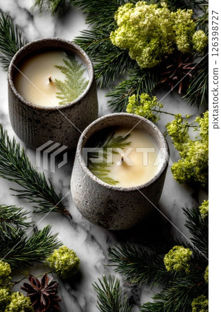 Two Gray Textured Candles with Green Accents on Marble 126398727